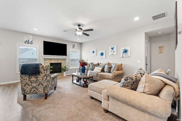 living room with recessed lighting, visible vents, and baseboards