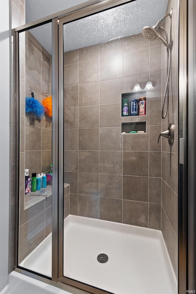 bathroom featuring a shower stall