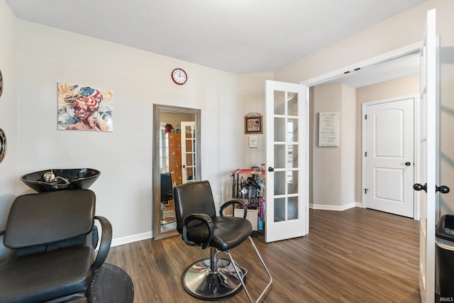 sitting room with french doors, baseboards, and dark wood-style flooring