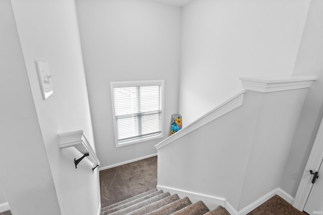 stairs with baseboards and carpet flooring