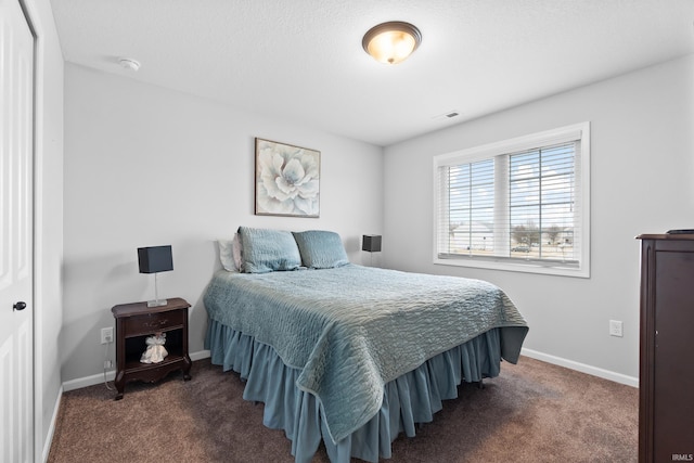 bedroom with visible vents, baseboards, and carpet floors