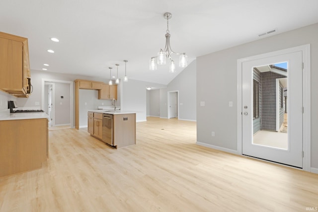 kitchen with a sink, stainless steel appliances, light wood-style floors, and light countertops