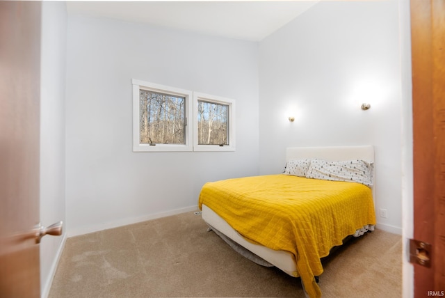 carpeted bedroom featuring baseboards