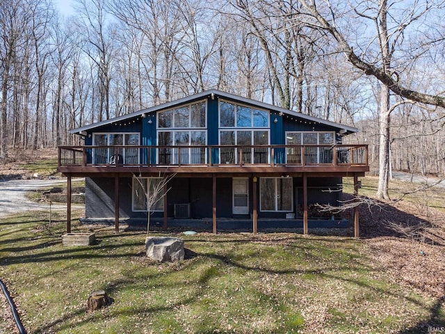 back of house with a deck, a yard, and central AC unit