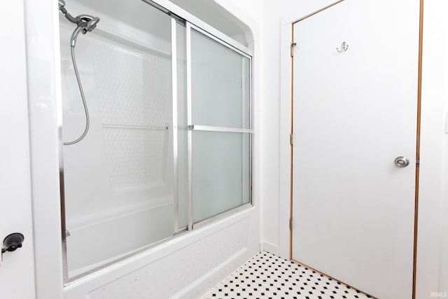 full bathroom featuring combined bath / shower with glass door