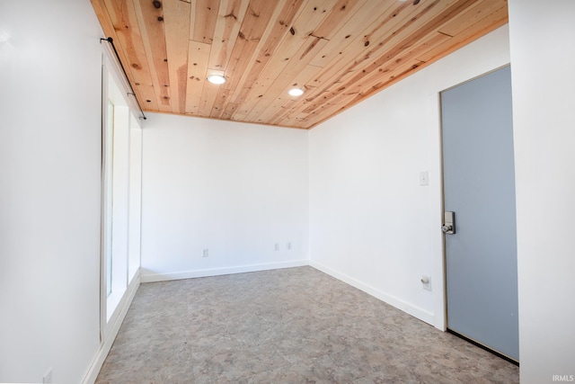 spare room with wooden ceiling, recessed lighting, and baseboards