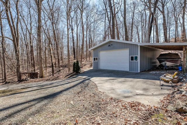 garage with a garage and driveway