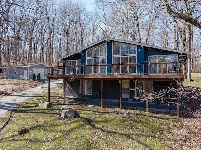 back of house featuring a deck