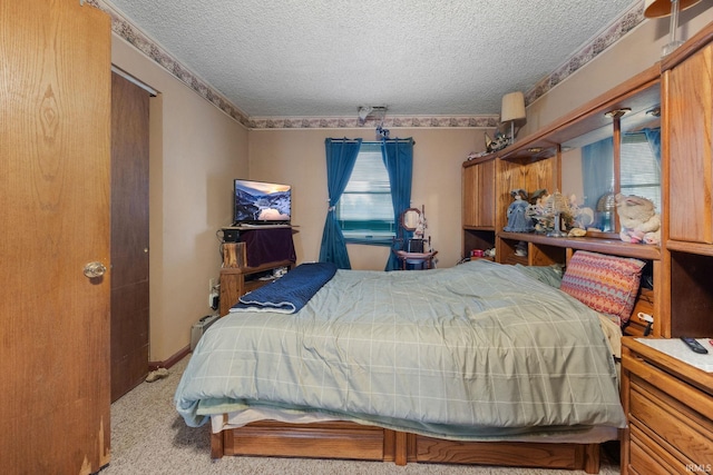 carpeted bedroom with a textured ceiling