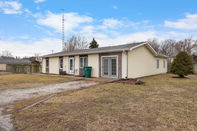 back of house with a yard and fence