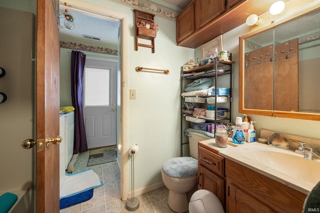 bathroom with visible vents, baseboards, toilet, and vanity