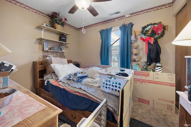 bedroom featuring visible vents and a ceiling fan