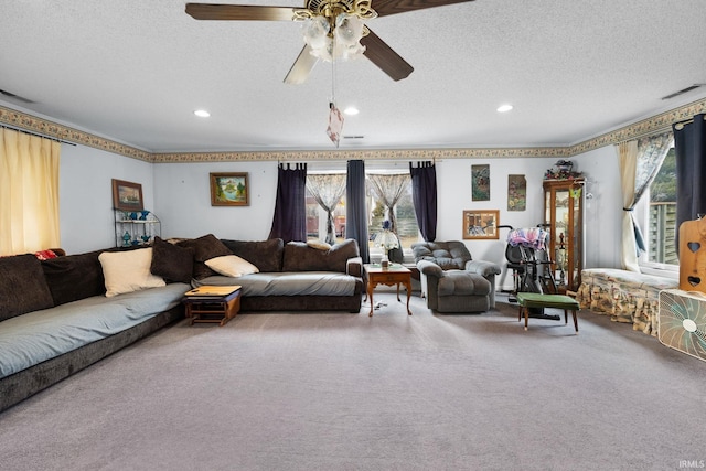 living room with visible vents, a ceiling fan, a textured ceiling, recessed lighting, and carpet flooring