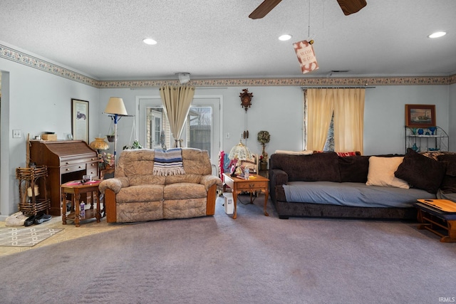 living room featuring ceiling fan, recessed lighting, carpet, and a textured ceiling