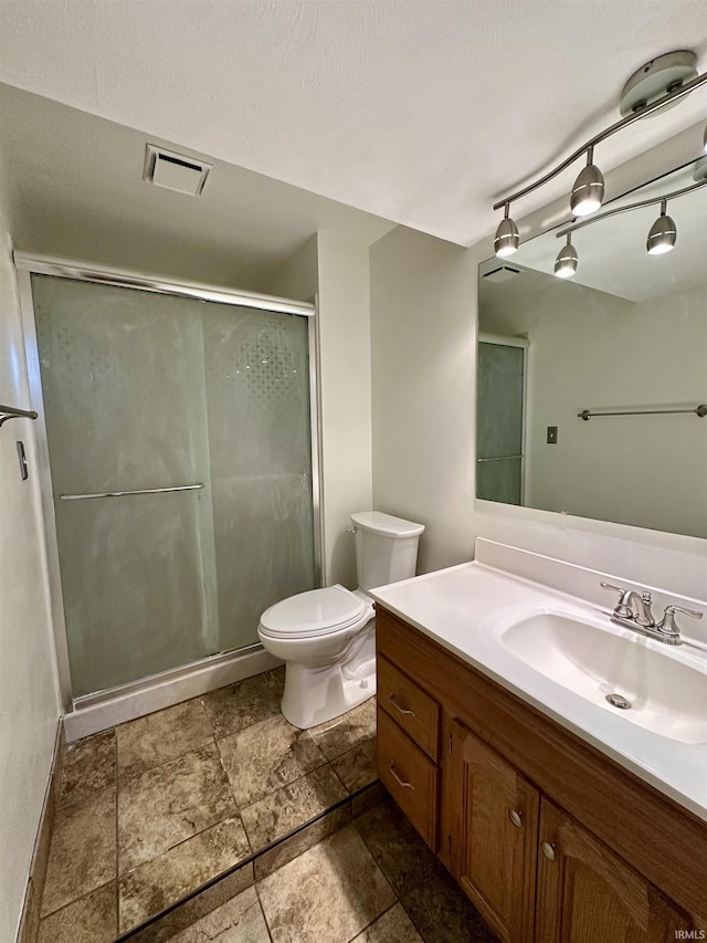 full bathroom with visible vents, vanity, toilet, and a shower stall