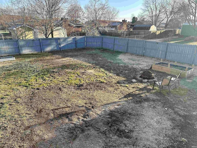 view of yard with a vegetable garden and fence