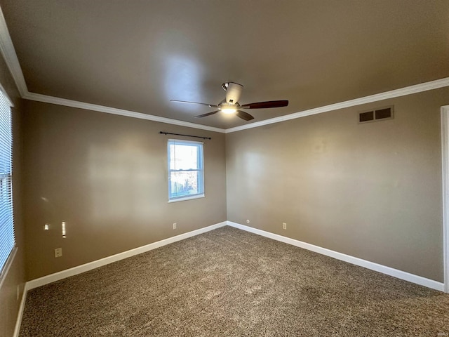 spare room with visible vents, baseboards, and ornamental molding