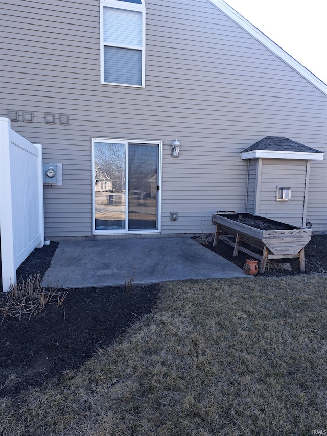 rear view of house with a patio area and a yard