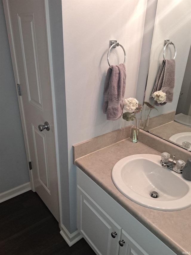 bathroom featuring vanity and baseboards