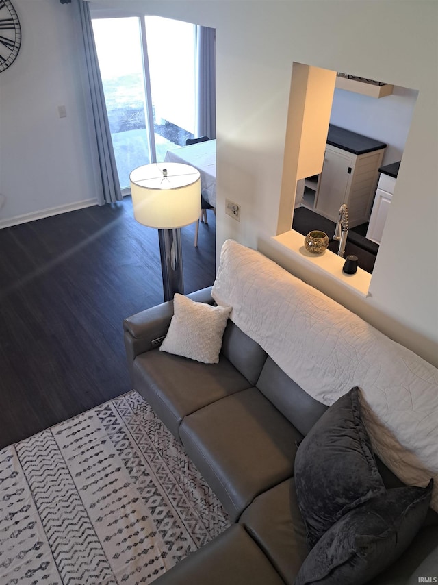 living area featuring wood finished floors and baseboards