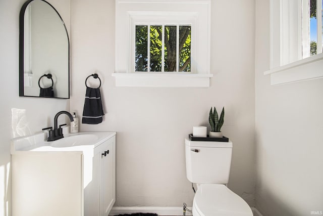 half bath with vanity and toilet