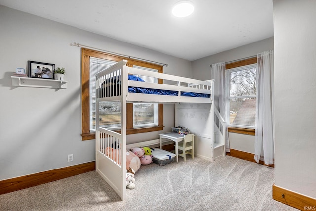 bedroom with carpet flooring and baseboards