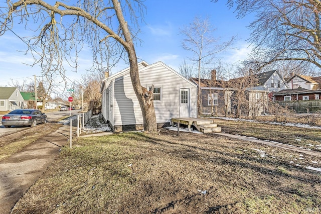 exterior space featuring a residential view and a chimney