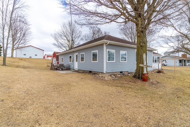 rear view of property with a yard