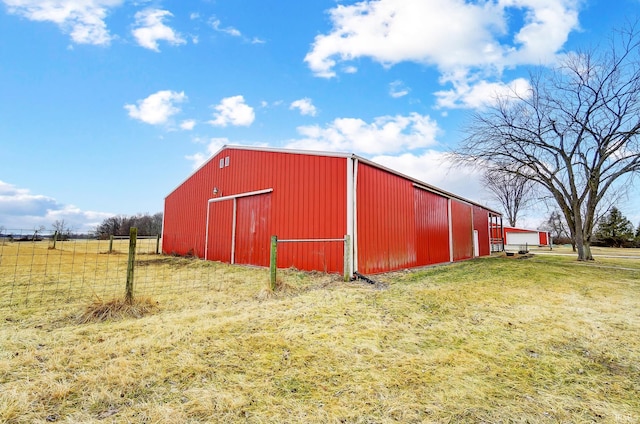 view of pole building with a yard