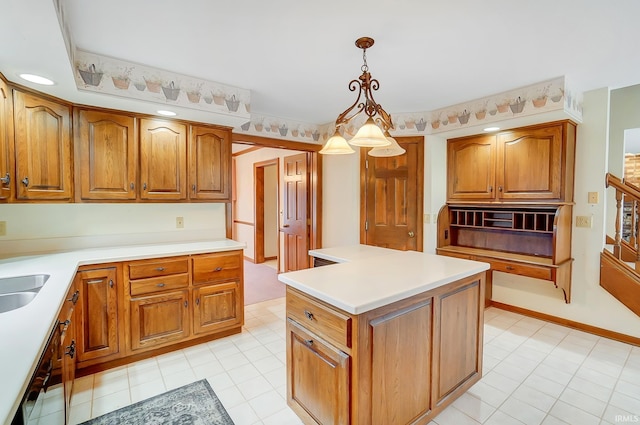 kitchen with brown cabinets, pendant lighting, a center island, and light countertops