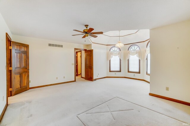 spare room with light colored carpet, a notable chandelier, baseboards, and visible vents