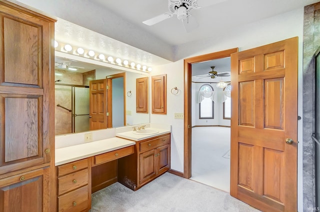 full bath with baseboards, an enclosed shower, vanity, and ceiling fan