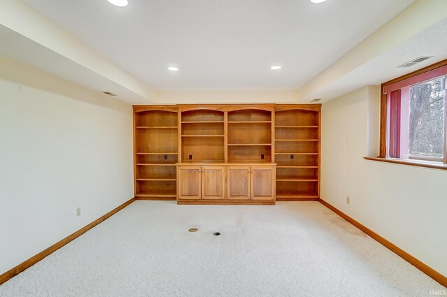 unfurnished room with light colored carpet, recessed lighting, visible vents, and baseboards