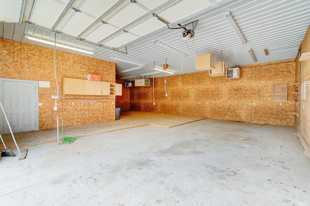 garage featuring a wall mounted AC