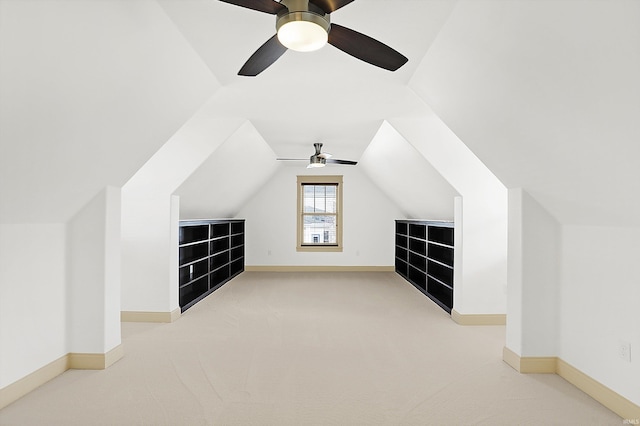 bonus room featuring light colored carpet, baseboards, and lofted ceiling