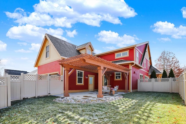 back of property featuring a patio area, a fenced backyard, a pergola, and a lawn