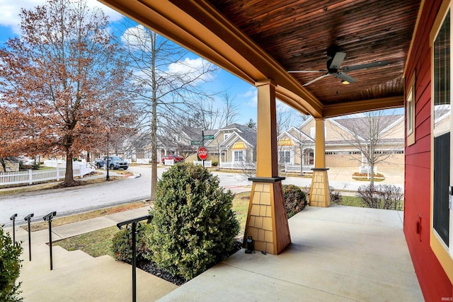 view of patio with a residential view and a porch