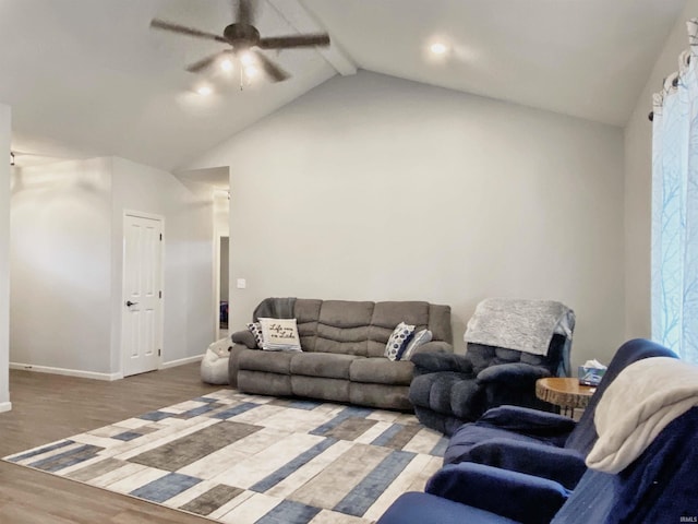 living room featuring beamed ceiling, high vaulted ceiling, light wood finished floors, baseboards, and ceiling fan