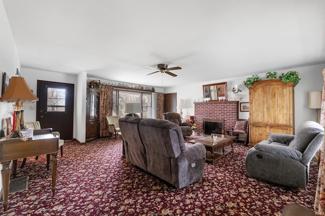 living room featuring carpet floors, a brick fireplace, and ceiling fan