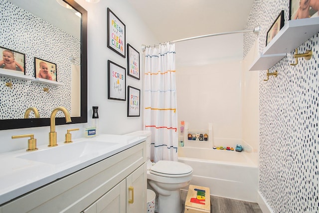 bathroom with shower / bathtub combination with curtain, toilet, wood finished floors, and vanity