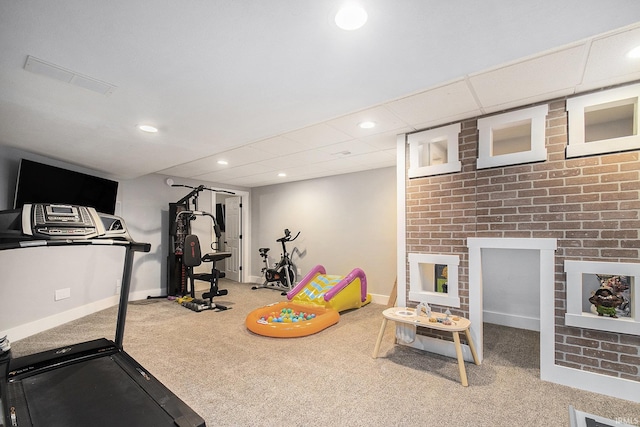 exercise room featuring recessed lighting, a drop ceiling, baseboards, and carpet