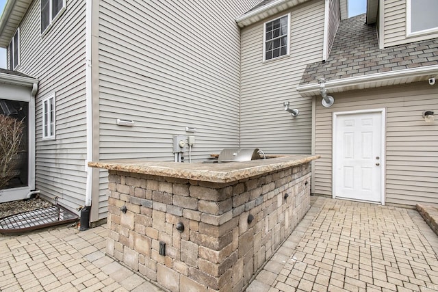 view of patio with exterior kitchen