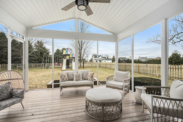 sunroom / solarium with vaulted ceiling and a ceiling fan