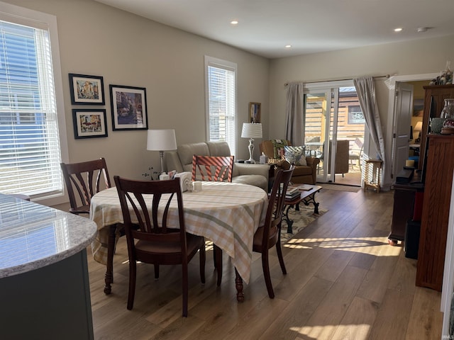 dining space with recessed lighting and dark wood-style flooring