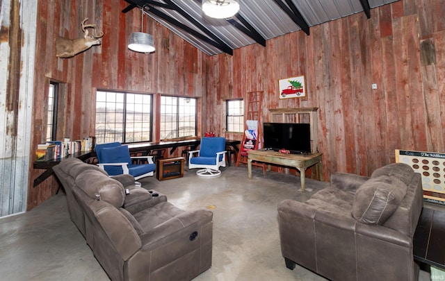 6889 N County Road 775 E, Grandview, IN 47615 - living room featuring beamed ceiling, wood walls, concrete flooring, and high vaulted ceiling