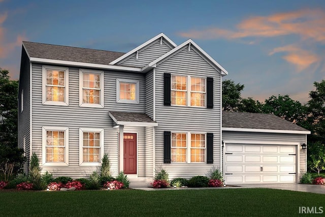 view of front of home with a front lawn, concrete driveway, an attached garage, and a shingled roof