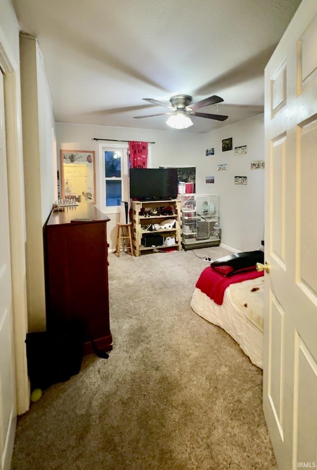 carpeted bedroom featuring a ceiling fan