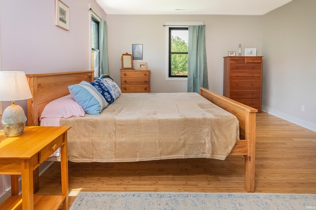 bedroom with wood finished floors