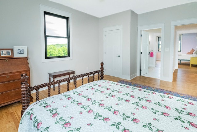 bedroom with light wood finished floors