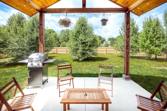 view of patio / terrace featuring a gazebo, a grill, and fence